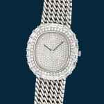 A white gold and diamond-paved bracelet watch | Circa 1995