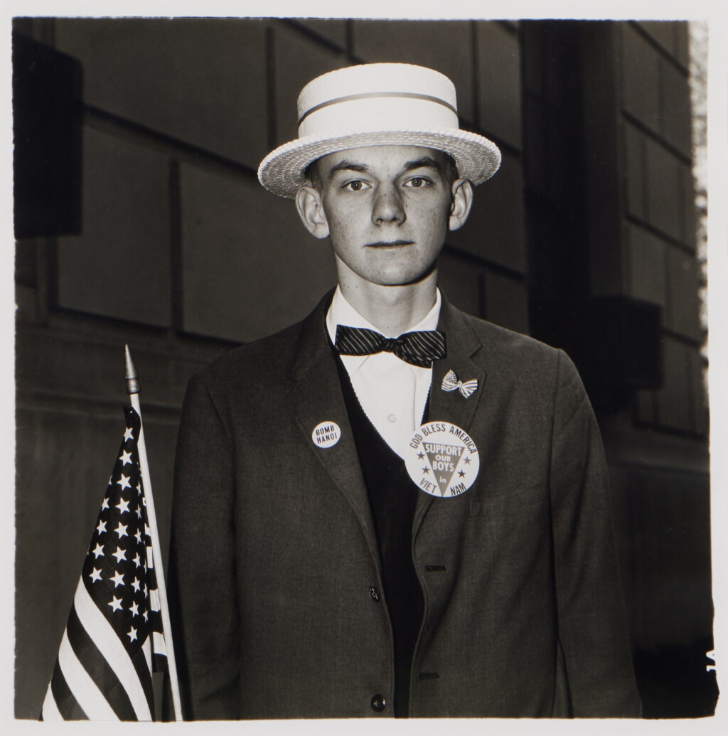 View full screen - View 1 of Lot 143. 'Boy with a straw hat waiting to march in a pro-war parade, N. Y. C.'.