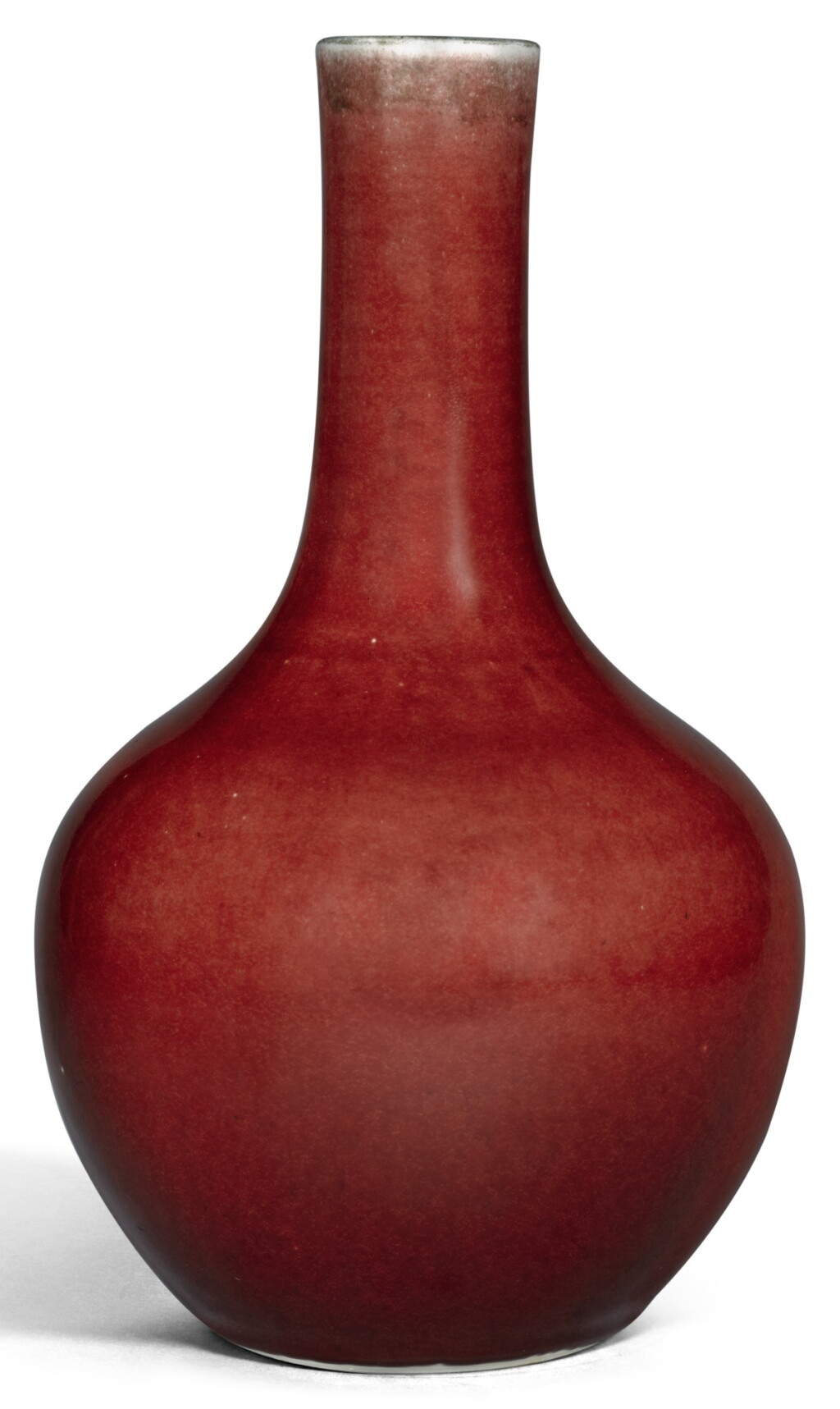View full screen - View 1 of Lot 343. A COPPER-RED GLAZED BOTTLE VASE QING DYNASTY, 18TH CENTURY | 清十八世紀 紅釉長頸瓶.