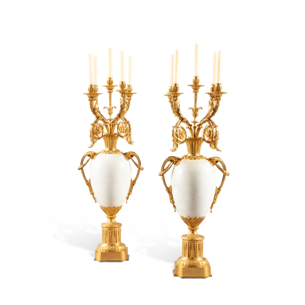 View full screen - View 1 of Lot 1385. A pair of Louis XVI style gilt-bronze and white marble five-light candelabra, 19th century.