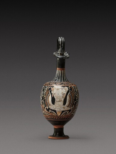 View full screen - View 1 of Lot 21. An Apulian Red-figured Oinochoe, circa 330-310 B.C..
