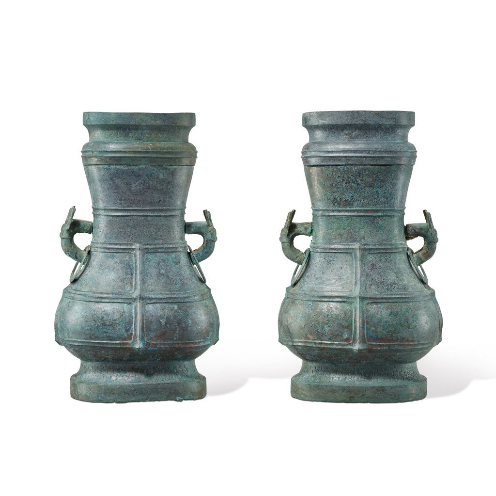 View full screen - View 1 of Lot 3003. A pair of large archaic bronze ritual wine vessels and cover, fanghu, Late Western Zhou - Eastern Zhou dynasty, early Spring and Autumn period 西周末至東周春秋初 青銅蟠螭紋獸耳帶蓋方壺一對.