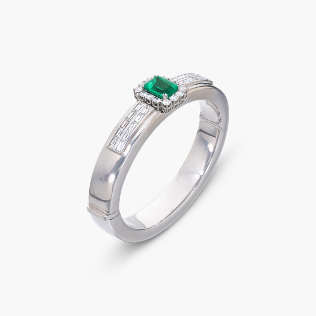 View full screen - View 1 of Lot 802. Emerald and Diamond Bangle.