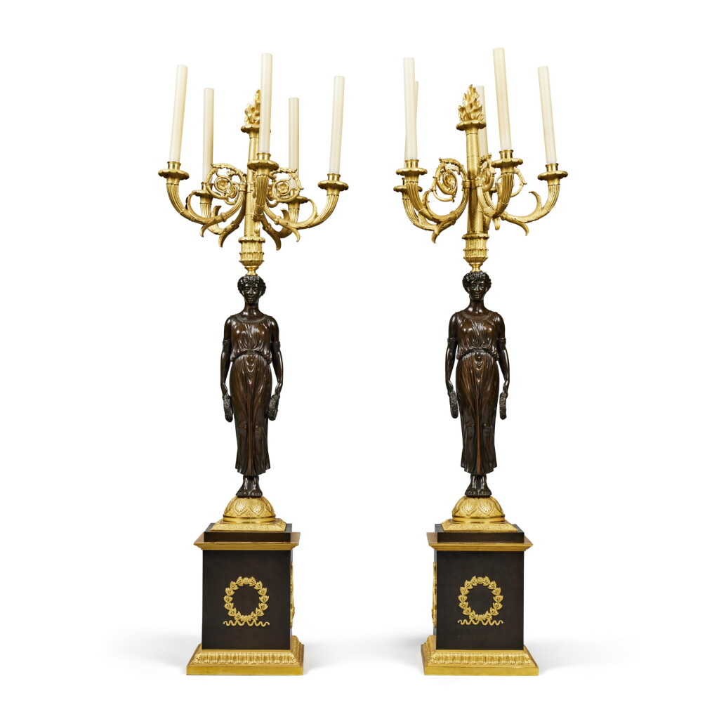 View full screen - View 1 of Lot 207. A Pair of Large Empire Style Gilt and Patinated Bronze Figural Five-Light Candelabra.