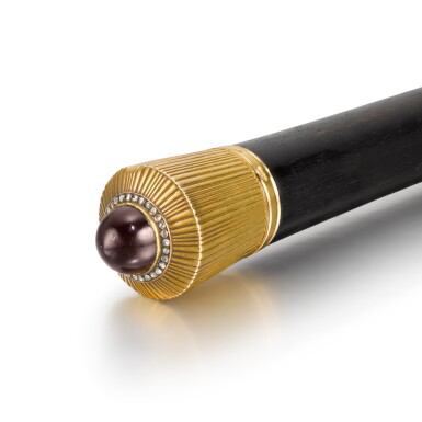 View full screen - View 1 of Lot 99. A Fabergé gold and almandine garnet cane handle, workmaster Erik Kollin, St Petersburg, circa 1890.
