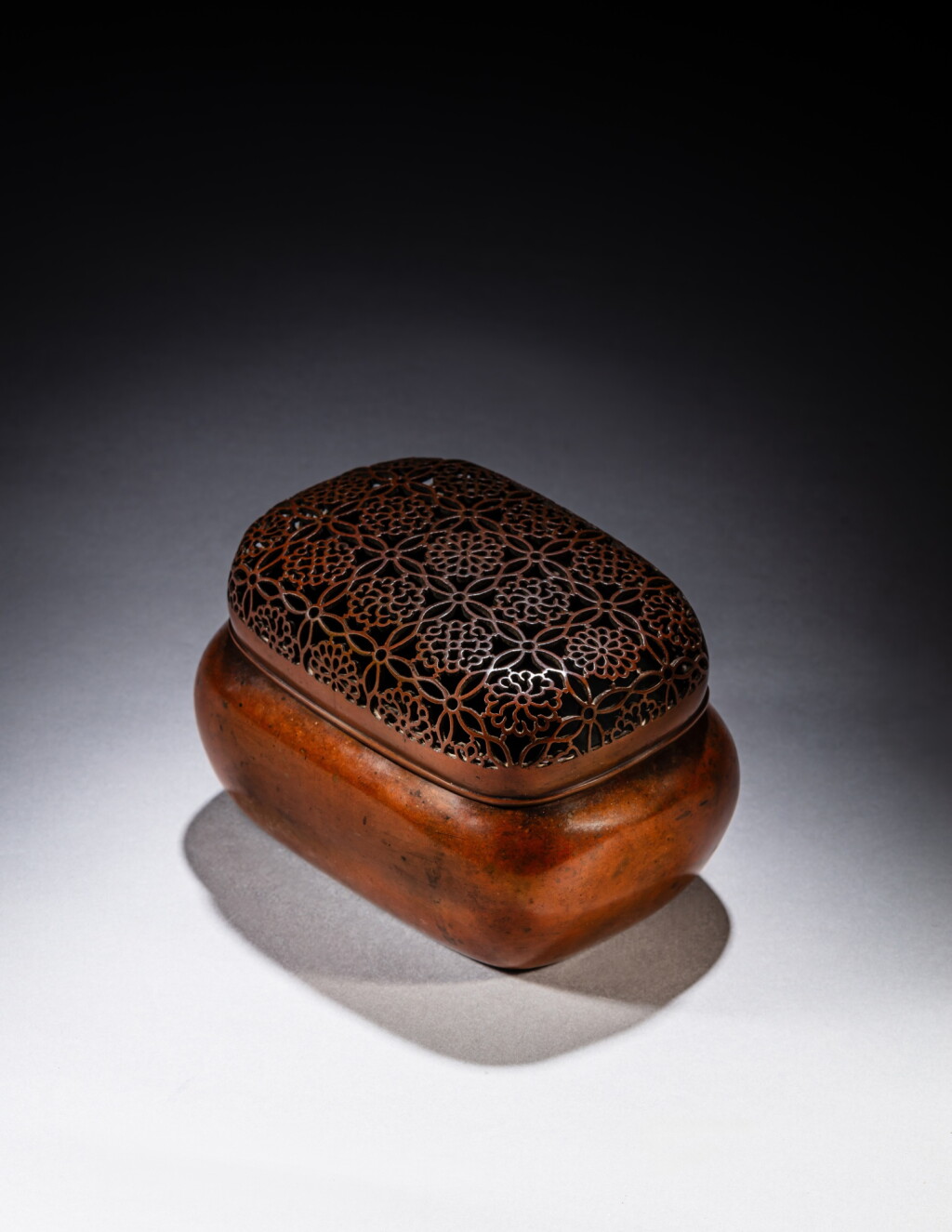 View full screen - View 1 of Lot 213. A copper-alloy hand warmer and cover, signed Zhang Mingqi, Late Ming dynasty | 明末 銅透空錦紋蓋手爐 《張鳴岐製》款.