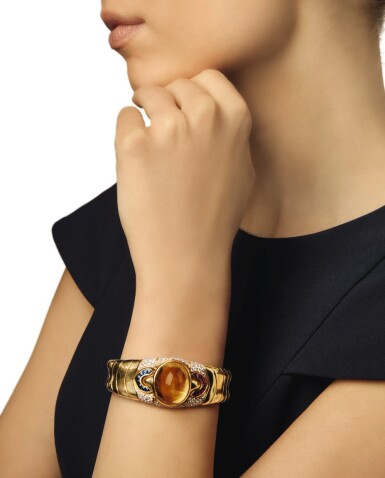 View full screen - View 1 of Lot 57. BULGARI | GOLD, GEM-SET AND DIAMOND CUFF-BRACELET.
