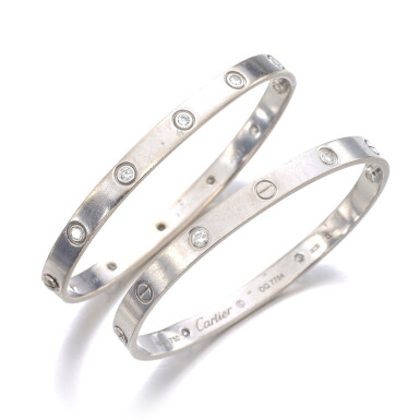 View full screen - View 1 of Lot 8. CARTIER | TWO GOLD AND DIAMOND BANGLES, 'LOVE'.