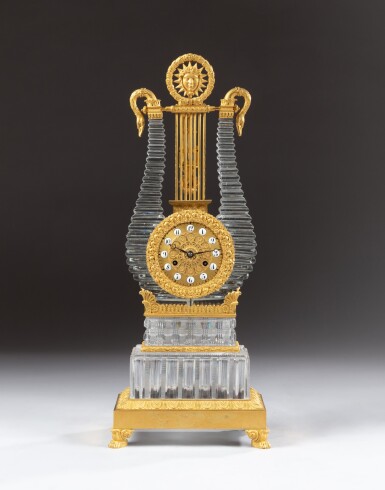 View full screen - View 1 of Lot 19. A lyre clock in gilt bronze and cut Vonêche crystal, Charles X period, circa 1820, attributed à l'Escalier de cristal (widow Désarnaud, Palais Royal) | Pendule lyre en bronze doré et cristal de Vonêche taillé, d'epoque Charles X, vers 1820, attribué à l'Escalier de cristal (veuve Désarnaud, Palais Royal).