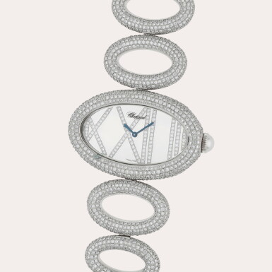 View full screen - View 1 of Lot 409. Cat's Eye, Reference 11/9054 | A white gold and diamond-set bracelet watch | Circa 2010.