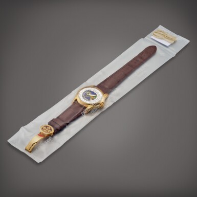 View full screen - View 1 of Lot 2255. Reference 5131 | A yellow gold world time wristwatch with cloisonné enamel dial in single factory seal, Circa 2012 | 百達翡麗 | 型號5131 | 黃金世界時間腕錶,備掐絲琺瑯錶盤,原廠未開封,約2012年製.