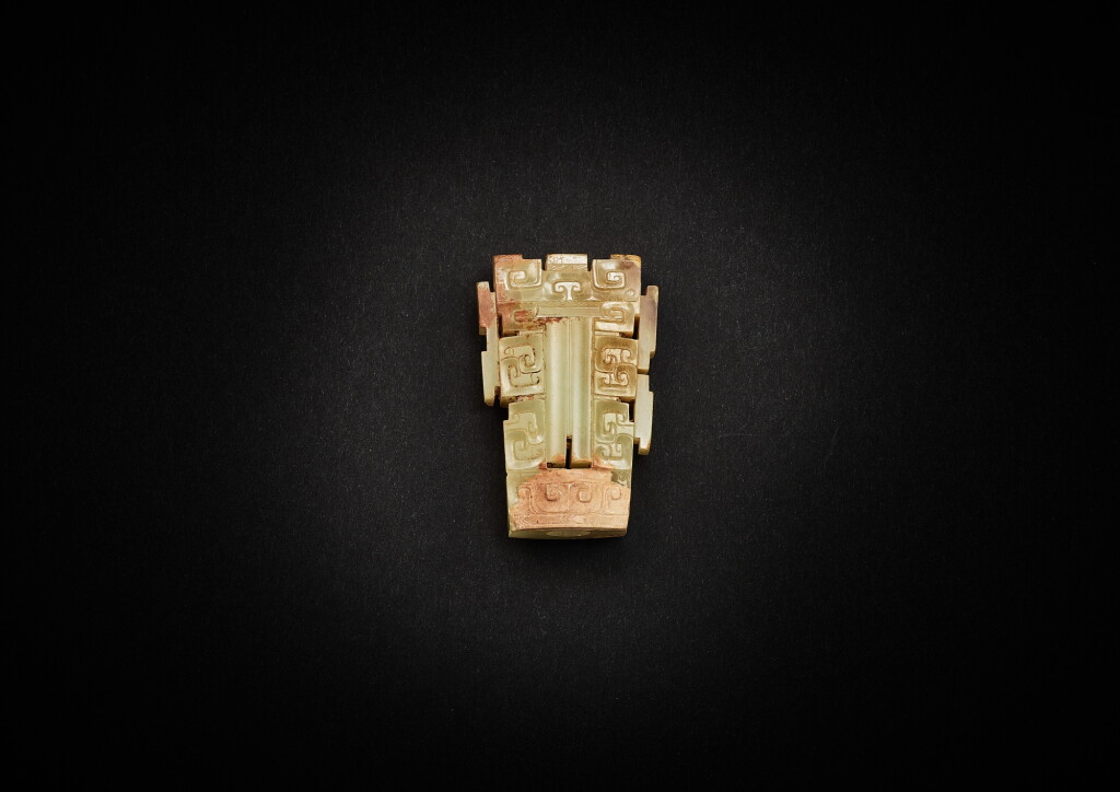 View full screen - View 1 of Lot 3834. A pale celadon jade sword chape, Eastern Zhou dynasty, late Warring States period - early Western Han dynasty | 東周戰國晚期至西漢早期 淺青白玉劍珌.