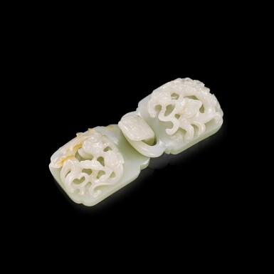 View full screen - View 1 of Lot 3055. A pale celadon jade 'chilong and lingzhi' belt buckle, Qing dynasty, 18th century 清十八世紀 青白玉螭龍靈芝紋帶扣.