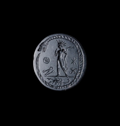 View full screen - View 1 of Lot 252. A "Graeco-Egyptian" Black Steatite Magical Amulet, circa 3rd Century A.D..