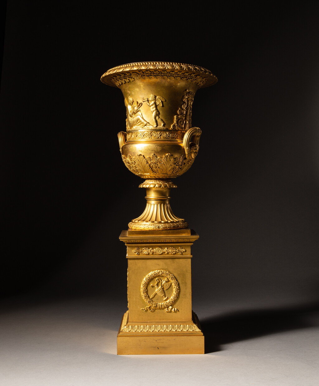 View full screen - View 1 of Lot 19. A gilt-bronze Medicis vase, Empire, circa 1810, probably by Pierre-Philippe Thomire | Vase Médicis en bronze doré d'époque Empire, vers 1810, probablement par Pierre-Philippe Thomire.