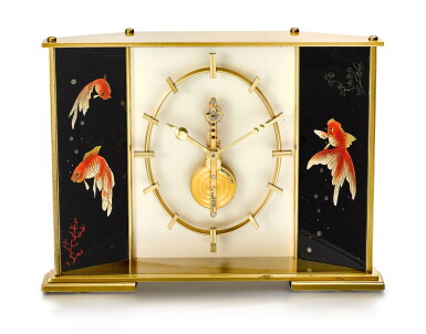 View full screen - View 1 of Lot 209. LECOULTRE | A GILT BRASS DESK CLOCK WITH ENAMEL GOLDFISH PANEL, CIRCA 1970.