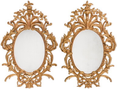 View full screen - View 1 of Lot 102. A pair of George III carved giltwood oval mirrors, circa 1765.