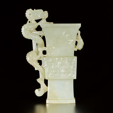 View full screen - View 1 of Lot 183. An archaisitc pale green jade 'dragon' vase, Qing dynasty, 19th century | 清十九世紀 青玉雕仿古饕餮螭龍紋尊.