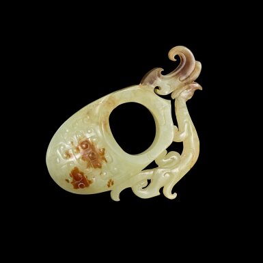 View full screen - View 1 of Lot 3613. A pale celadon and russet jade 'archer’s ring' ornament, Western Han dynasty | 西漢 青白玉鏤雕鳳紋韘.