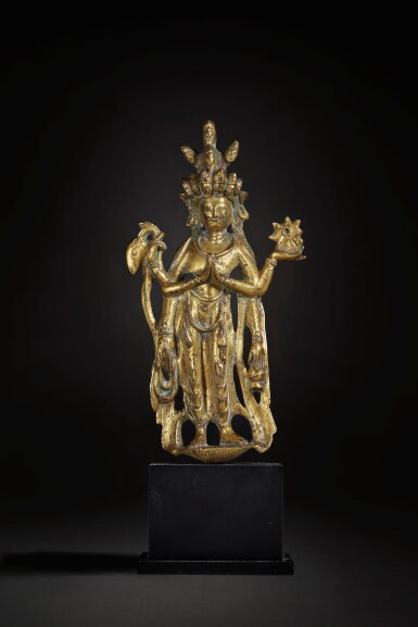 View full screen - View 1 of Lot 161. An extremely rare gilt-bronze figure of eleven-headed Avalokiteshvara, Tang dynasty.