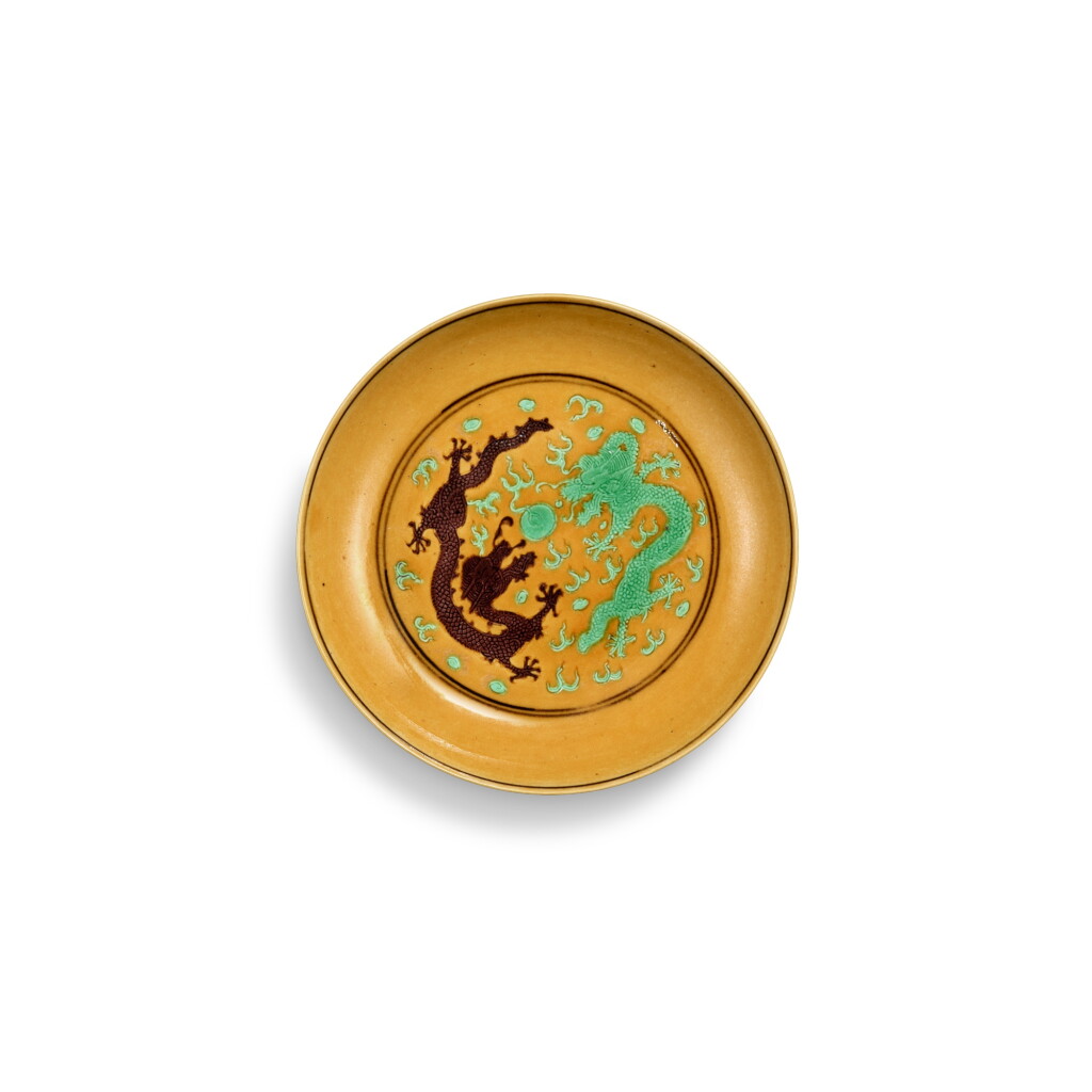 View full screen - View 1 of Lot 3401. A yellow-ground green-and-aubergine-enamelled 'dragon' saucer, Mark and period of Tongzhi | 清同治 黃地紫綠彩雙龍戲珠紋小盤 《大清同治年製》款.