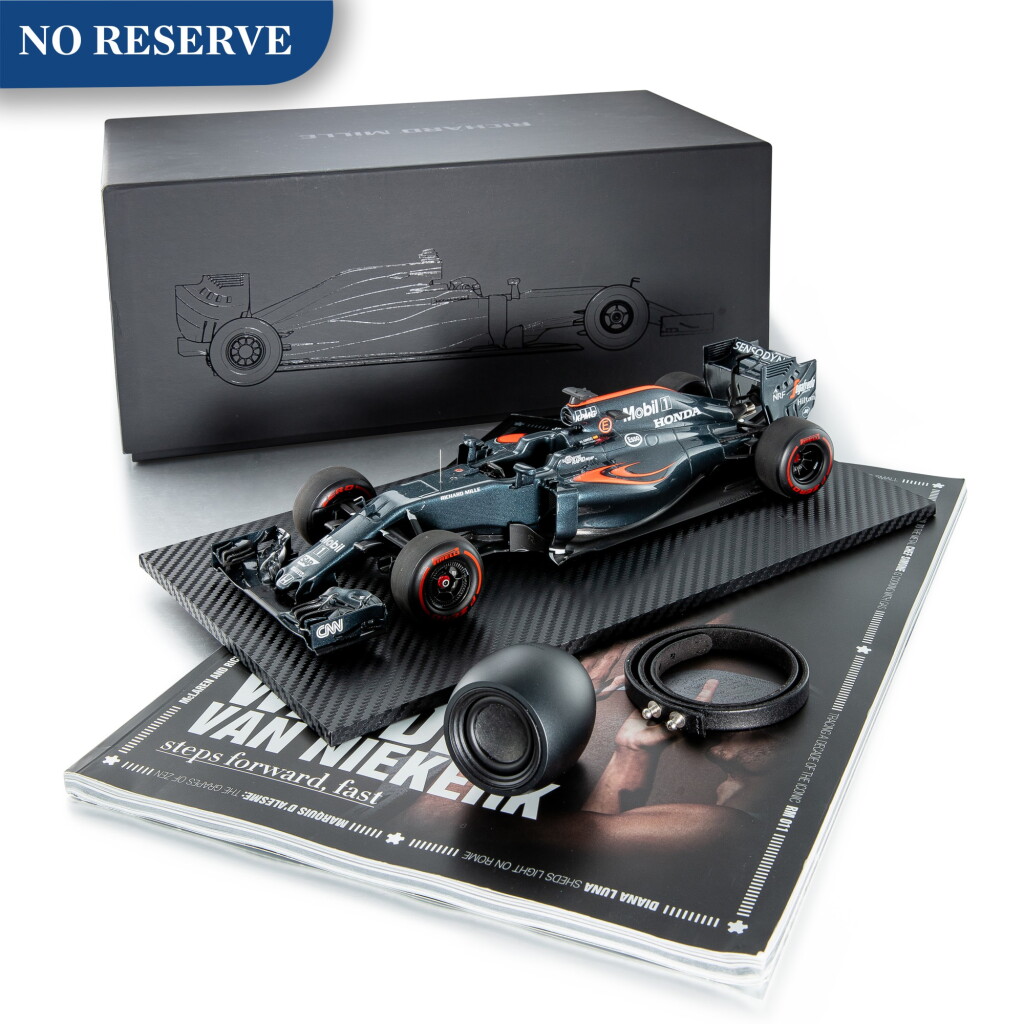 View full screen - View 1 of Lot 110. RICHARD MILLE | A SET OF PROMOTIONAL MEMORABILIA, INCLUDING A 1:18 RACE CAR MODEL, LEATHER BRACELET, MAGAZINE AND EGGI WIRELESS SPEAKER, CIRCA 2017.