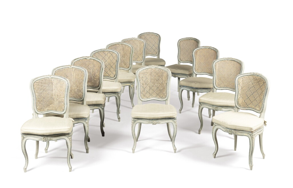 View full screen - View 1 of Lot 49. A set of twelve Louis XV style painted and caned side chairs | Suite de douze chaises en bois repeint de style Louis XV.