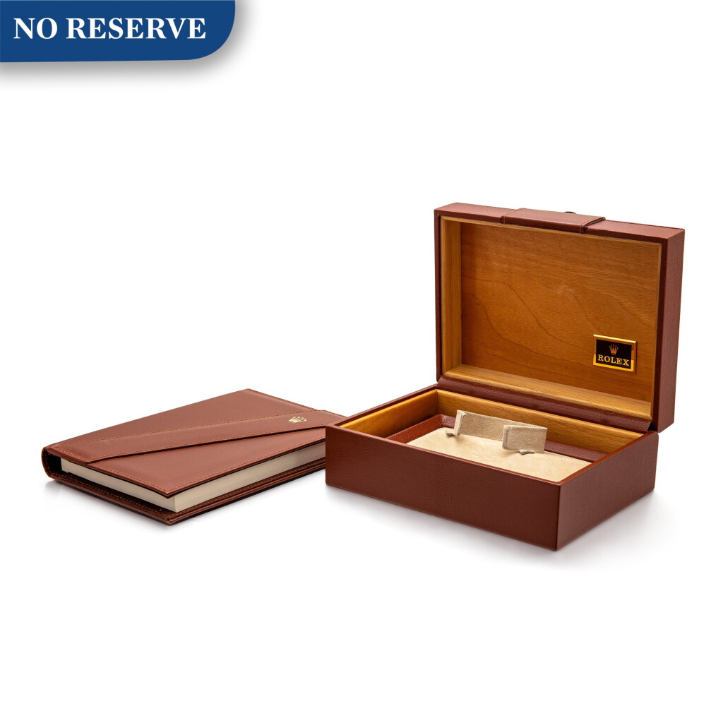 View full screen - View 1 of Lot 8023. Rolex | A leather and wooden presentation box, Circa 1985.