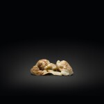 A celadon and russet jade 'Buddhist lion' group, Ming dynasty | 明 青玉雕太獅少獅