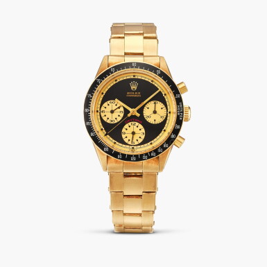 View full screen - View 1 of Lot 2400. Cosmograph Daytona 'Paul Newman John Player Special Cherry', Reference 6264 | A yellow gold chronograph wristwatch with bracelet, Circa 1971.