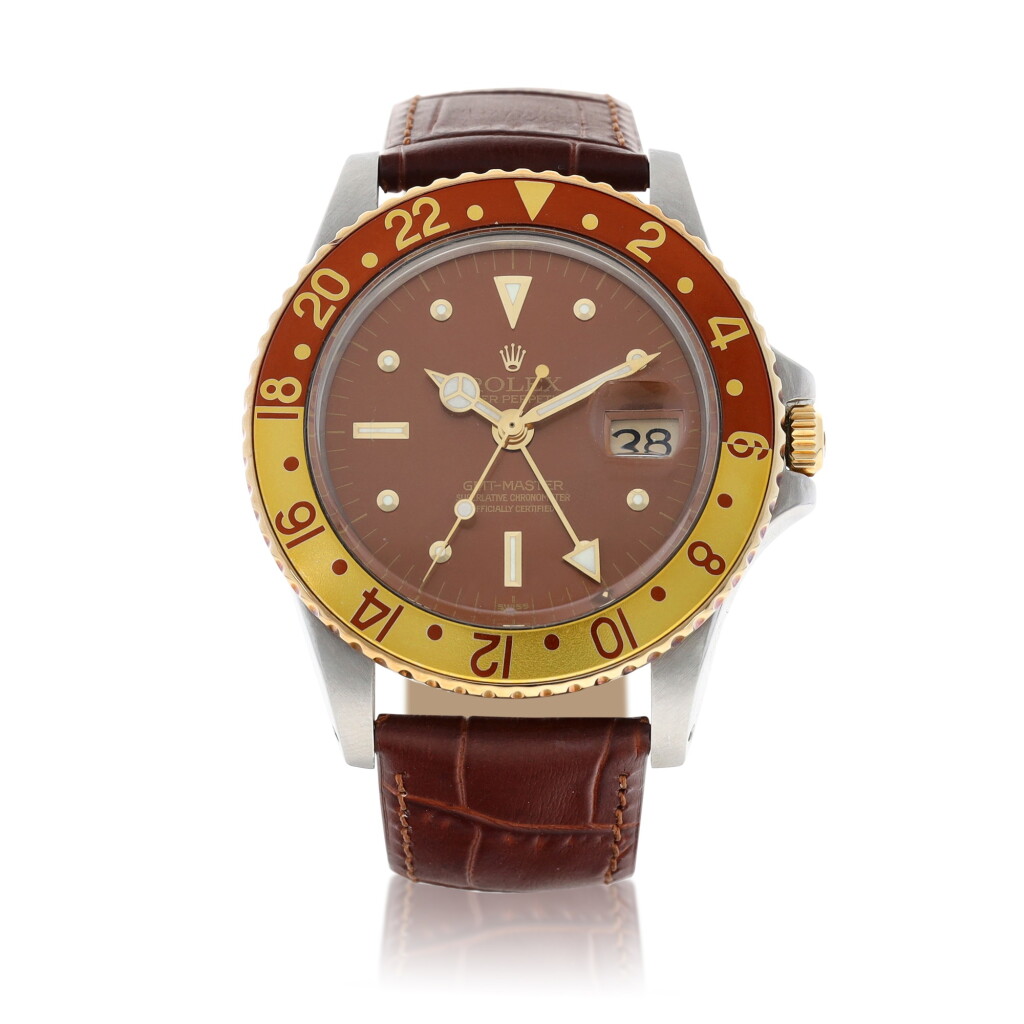 View full screen - View 1 of Lot 9243. Rolex | GMT-Master "Rootbeer", Reference 1675, A yellow gold and stainless steel dual time zone wristwatch with date, Circa 1972 | 勞力士 | GMT-Master "Rootbeer" 型號1675 黃金及精鋼兩地時間鏈帶腕錶,備日期顯示,約1972年製.