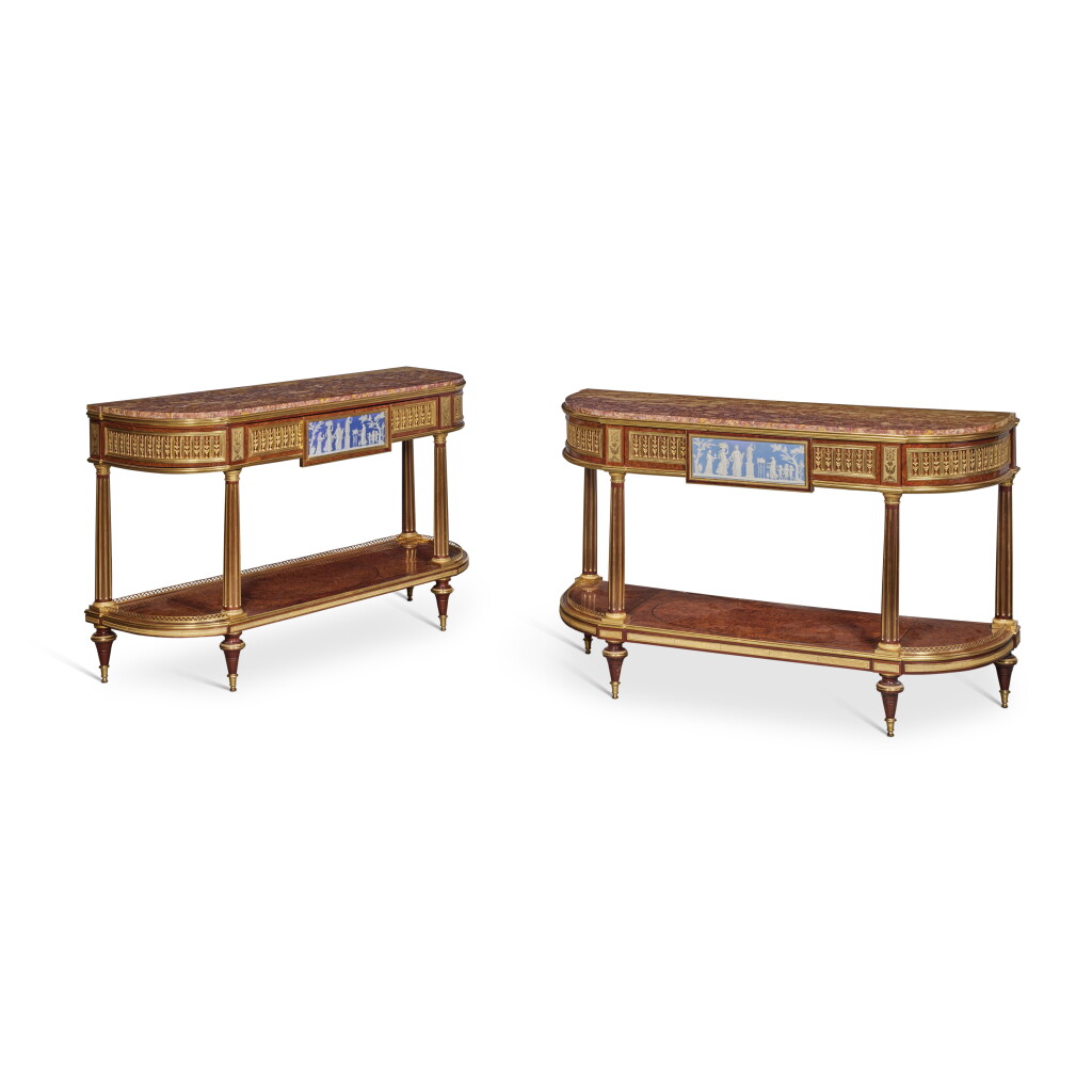View full screen - View 1 of Lot 212. A Matched Pair of Gilt-Bronze Mounted Mahogany, Thuya and Ebony-Inlaid Console Dessertes in the manner of Weisweiler, Probably First Half 19th Century.
