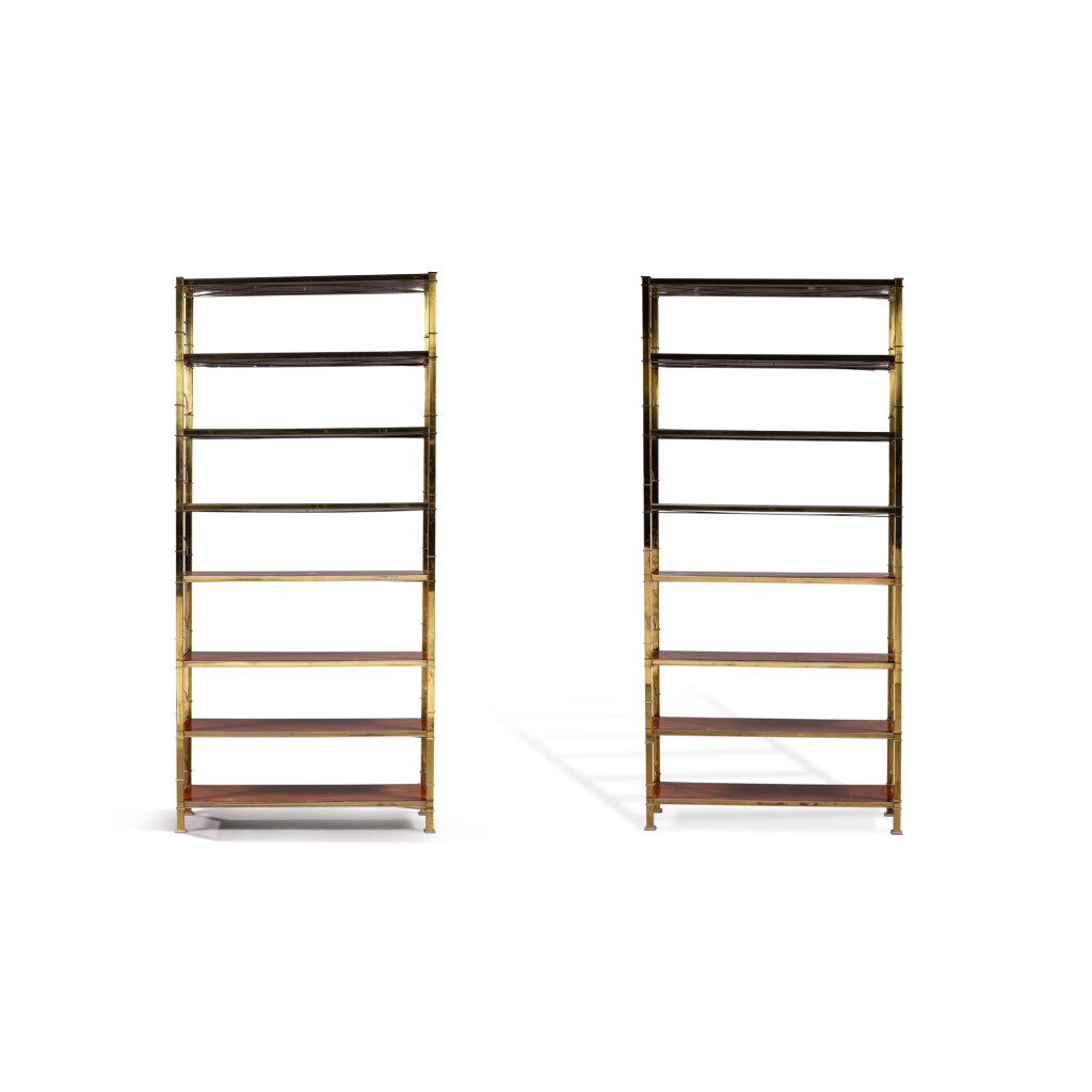 View full screen - View 1 of Lot 125. A pair of gilt-metal bookcases, modern, attributed to Maison Jansen | Paire de bibliothèques en métal doré, moderne, attribuée à la Maison Jansen.
