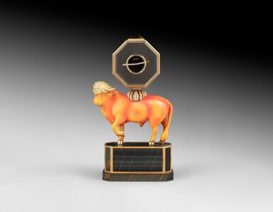 View full screen - View 1 of Lot 67. A French enamelled silver "bull" clock, on quartz base with gold mounts, Chaumet, Paris, circa 1980 | Pendule en argent émaillé orange en forme de taureau, la base en quartz montée en or, par Chaumet, Paris, vers 1980.