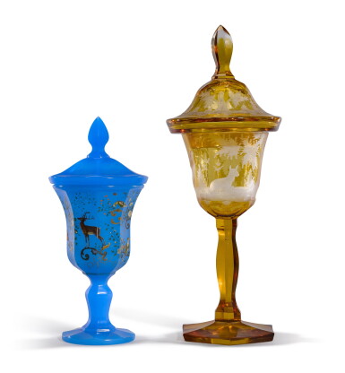 View full screen - View 1 of Lot 138. A Bohemian amber-stained and engraved glass goblet and cover and a semi-opaque blue alabaster glass goblet and cover, late 19th century.