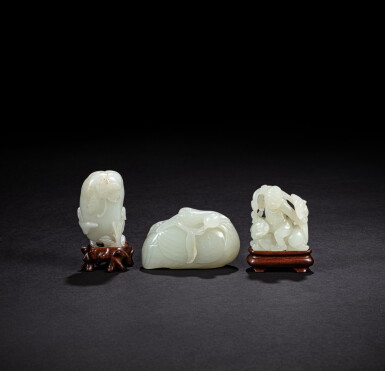 View full screen - View 1 of Lot 224. A group of three white jade carvings, Qing dynasty, 18th - 19th century | 清十八至十九世紀 白玉雕 一組三件.