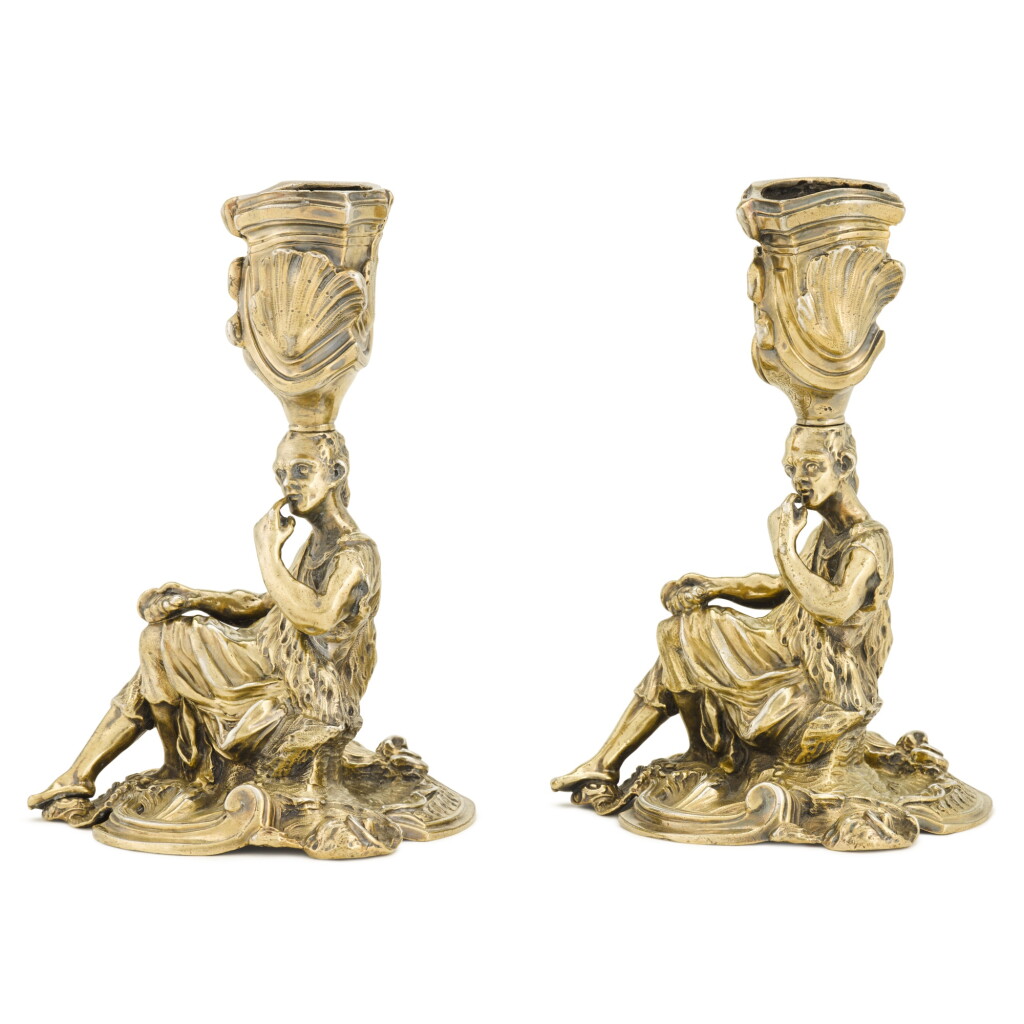 View full screen - View 1 of Lot 54. Two silver-gilt candlesticks, one unmarked, the other Robert Garrard, London, 1840 | Deux flambeaux en vermeil, un non poinçonné, l'autre par Robert Garrard, Londres, 1840.