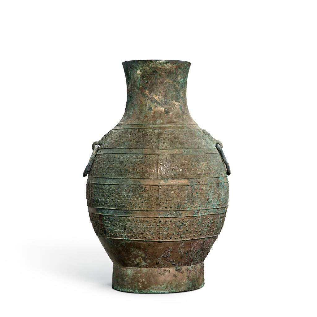 View full screen - View 1 of Lot 5638. An archaic bronze ritual wine vessel, hu, Eastern Zhou dynasty, Warring States period | 東周戰國 青銅蟠虺紋鋪首耳壺.