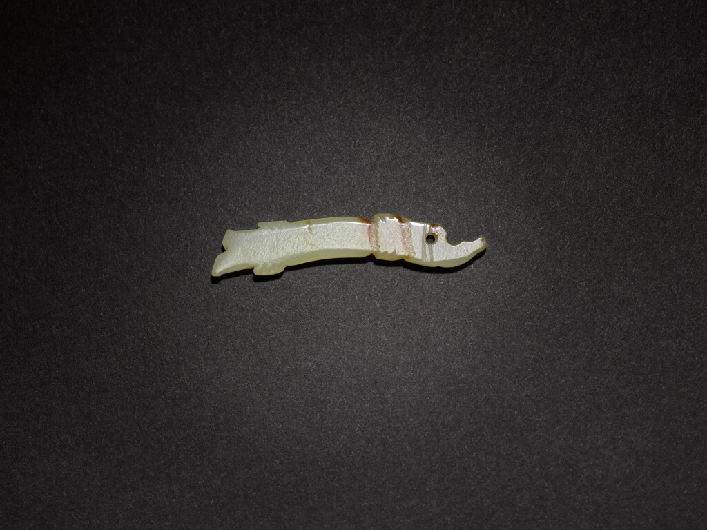 View full screen - View 1 of Lot 10. A white jade 'fish-dragon' pendant, Western Zhou dynasty.