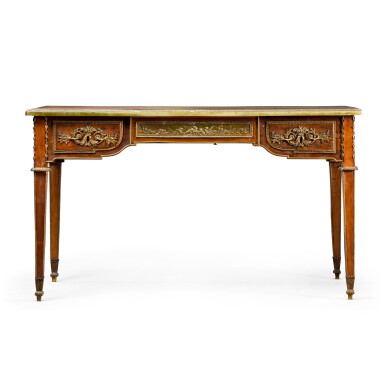 View full screen - View 1 of Lot 82. A LOUIS XVI STYLE GILT-BRONZE MOUNTED ACAJOU MOUCHETÉ BUREAU PLAT, AFTER THE MODEL BY JEAN-HENRI RIESENER, CIRCA 1870.