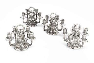 View full screen - View 1 of Lot 6. A set of four five-light silver candlesticks, Georg Jensen, Copenhagen, modern | Ensemble de quatre chandeliers à cinq lumières en argent par Georg Jensen, Copenhague, moderne.