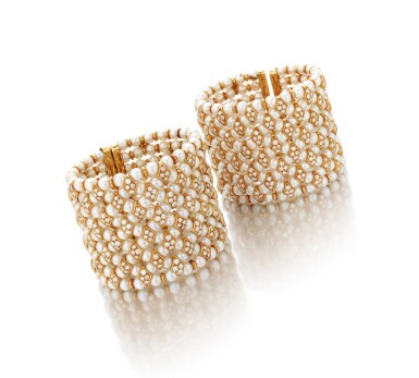 View full screen - View 1 of Lot 101. Pair of cultured pearl and diamond cuffs (Coppia di bracciali in perle coltivate e diamanti).