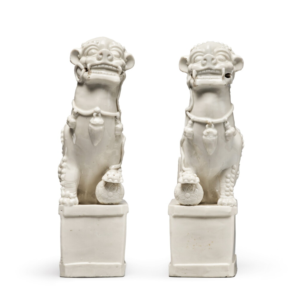 View full screen - View 1 of Lot 639. A pair of 'Dehua' 'Buddhist lion' joss stick holders, Qing dynasty, 18th century | 清十八世紀 德化白釉佛獅香插一對.