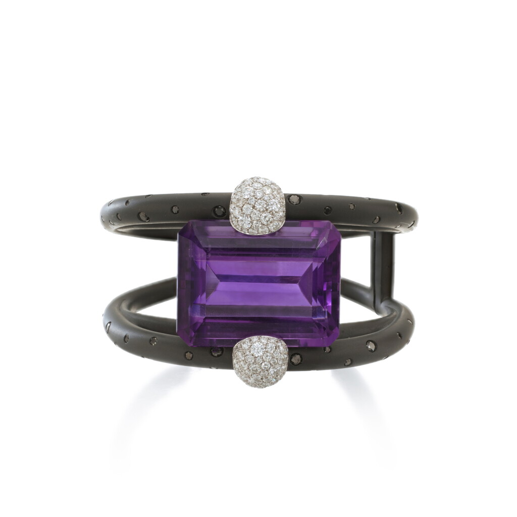 View full screen - View 1 of Lot 941. Amethyst and diamond bangle.