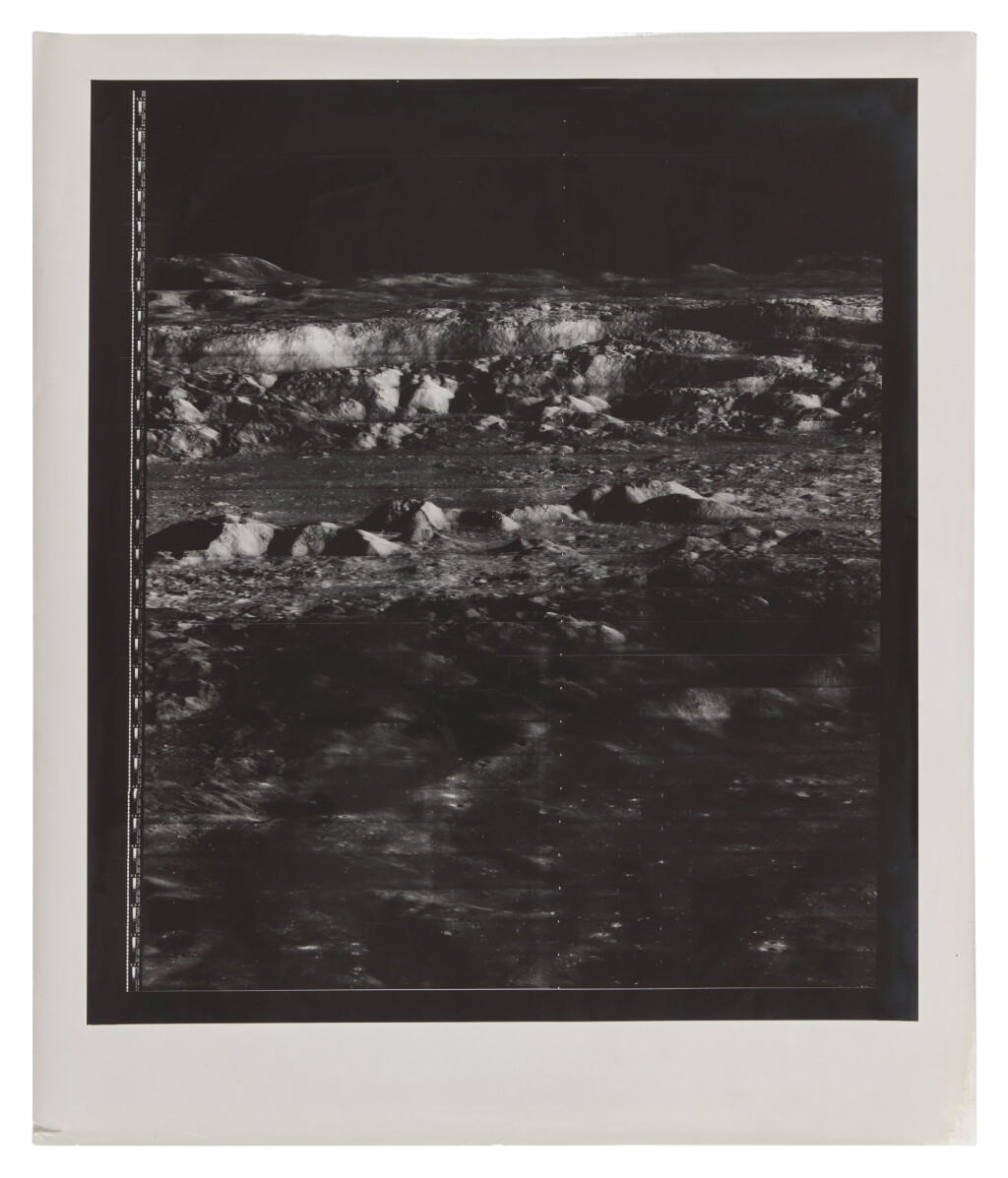 View full screen - View 1 of Lot 3. LUNAR ORBITER II. "THE PICTURE OF THE CENTURY" — OBLIQUE VIEW INTO CRATER COPERNICUS, 24 NOVEMBER, 1966..