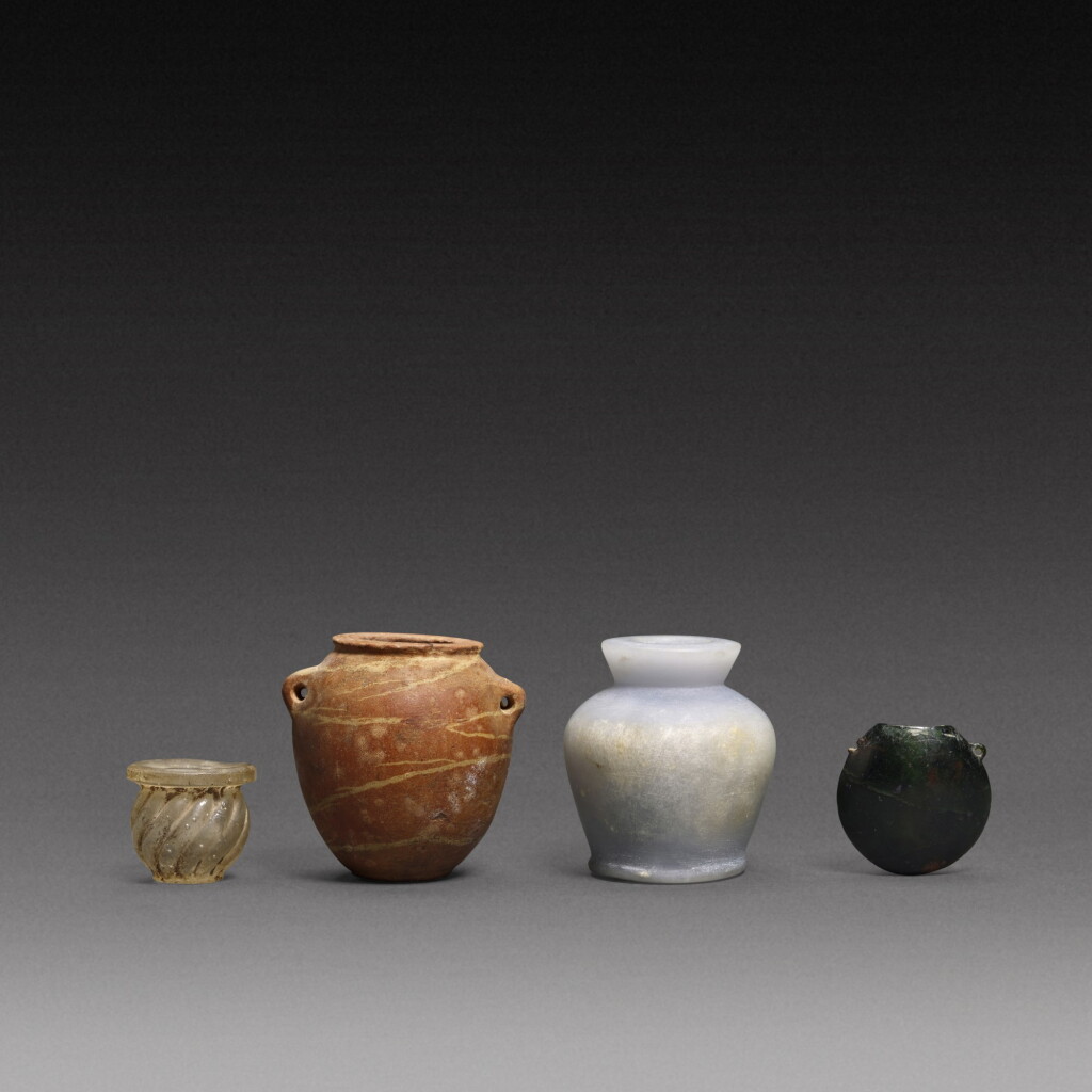 View full screen - View 1 of Lot 70. Four Miniature Vessels, circa 4th millennium B.C./1st Millennium A.D..