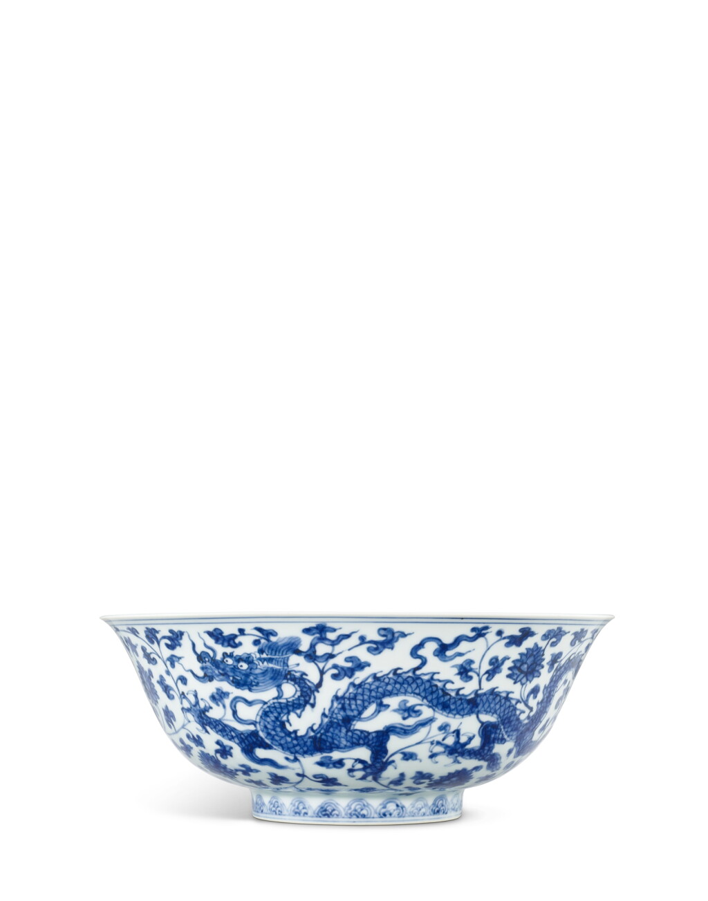 View full screen - View 1 of Lot 5047. A fine and large blue and white 'dragon' bowl, Mark and period of Zhengde | 明正德 青花穿蓮龍紋大盌 《正德年製》 款.