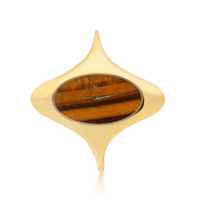 View full screen - View 1 of Lot 203. CHOPARD | RETAILED BY SATSKY & CO: AN UNUSUAL YELLOW GOLD BANGLE WATCH WITH TIGER'S EYE DIAL, CIRCA 1970.