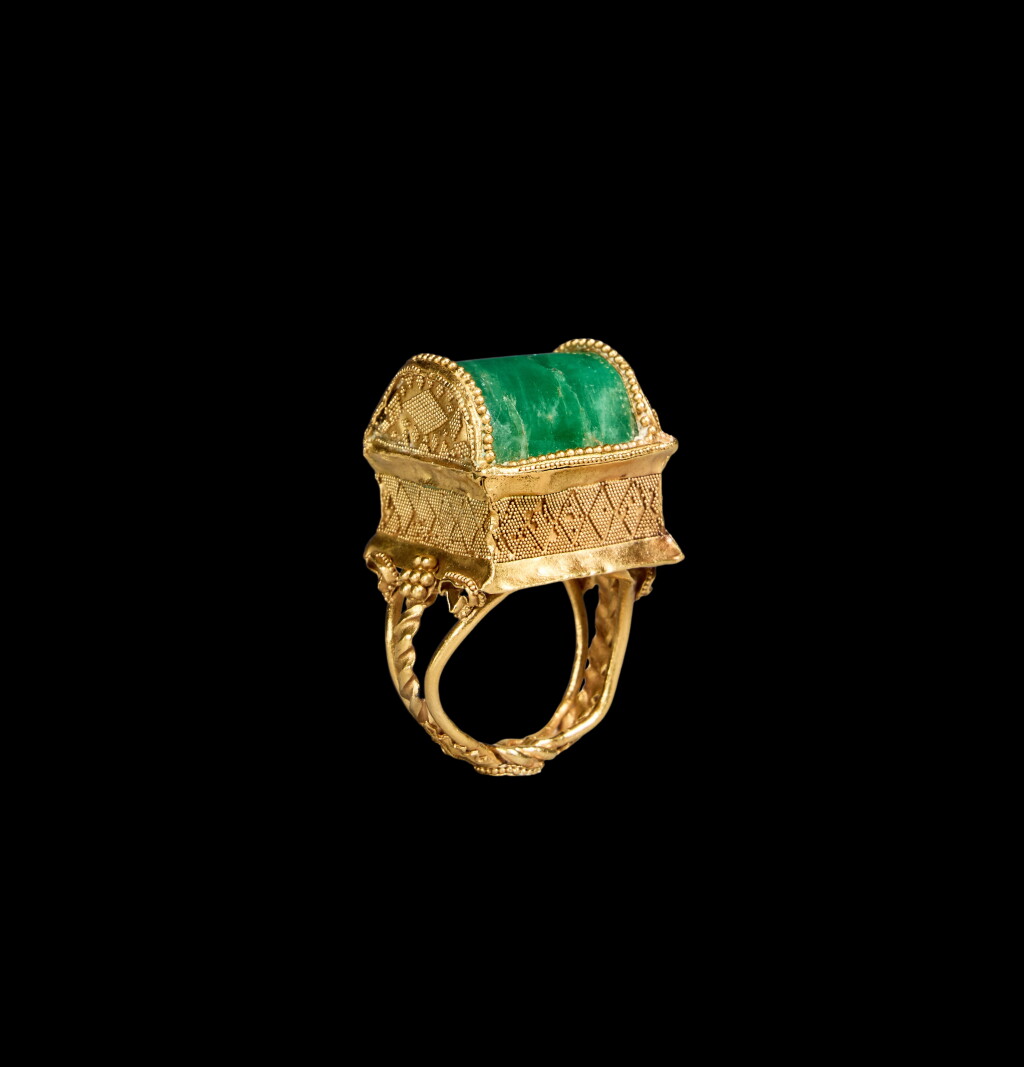 View full screen - View 1 of Lot 58. A Late Hellenistic Gold and Emerald Finger Ring, circa 1st Century B.C..