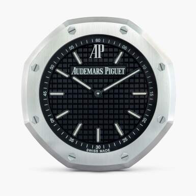 View full screen - View 1 of Lot 3. An aluminum wall clock, Circa 2014.